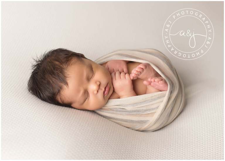 baby-boy-swaddle-neutral-colors