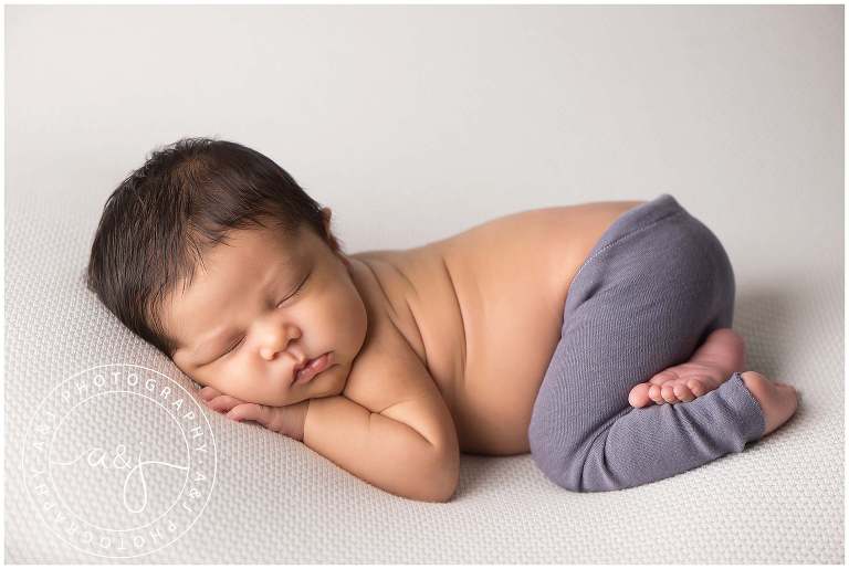 newborn-boy-blue-pants-photo